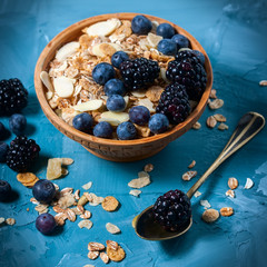 Granola with blueberries and blackberries. Healthy food.