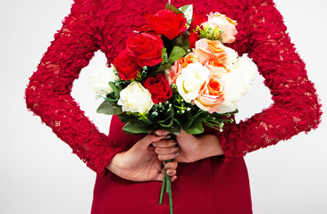 Rose bouquet was holding by lady hands,