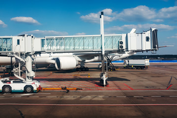 Obraz na płótnie Canvas Air plane in the airport near jet bridge