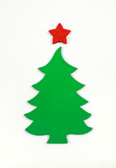 Little wooden christmas tree on the white background. Flat lay. Top view.