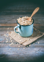 oat flakes on wooden table. healthy food concept.