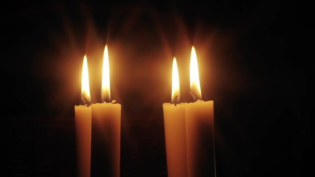 Christmas feeling with candles.  Close up on burning candles moving slowly in a circle.