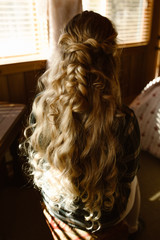 woman with long golden curly hair
