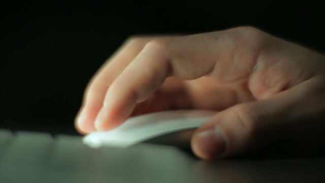 Hands typing on a keyboard and mouse