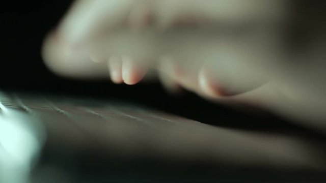 Hands typing on keyboard
