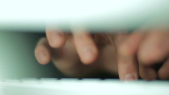 Hands typing on keyboard