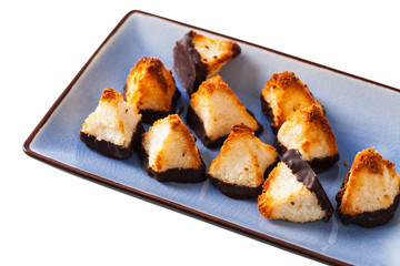 Golden Coconut Pyramids Cookies Isolated on White Background. Selective focus.