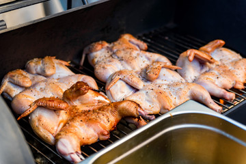 Roasted whole chicken onblack grill close up