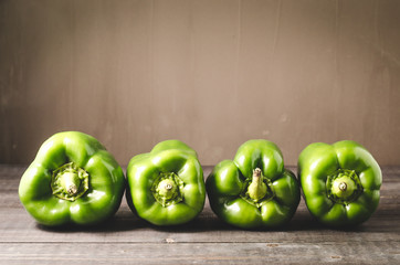 row green paprika pepper/fresh green paprika pepper on wooden table, selective focus