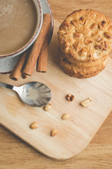 stacked chip cookies with nuts and coffee cup/stacked chip cookies with nuts and coffee cup. Top view