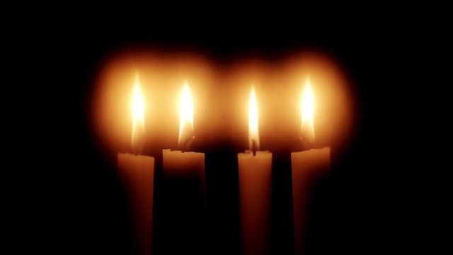 Christmas feeling with candles.  Close up on burning candles moving slowly in a circle.