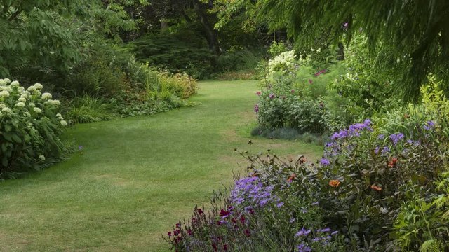 Tilt-Grassy path through a beautiful English country garden