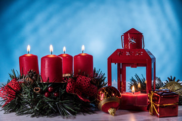 Christmas burning candles on a blue background