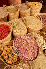 BASKETS OF DRIED HERBS IN MARKET