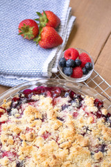 Close up on a baked berry cobbler, with space for text on top