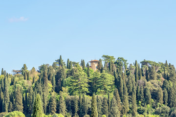 Fototapeta na wymiar House with a tower on a hill