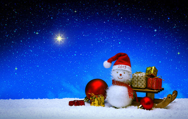 Naklejka na ściany i meble Christmas snowman with santa claus hat isolated on star sky background.