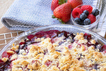 Close up on a freshly baked berry cobbler, with space for text on top