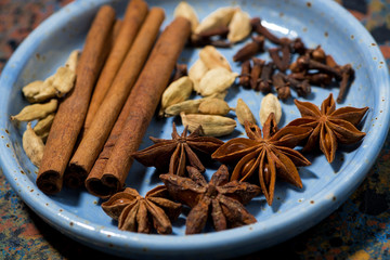 spices for masala tea in a plate