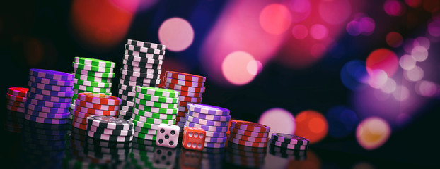 Poker chips piles and dice on abstract bokeh background, banner, copy space. 3d illustration