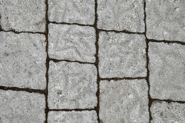 Square tile on the street, texture, background.