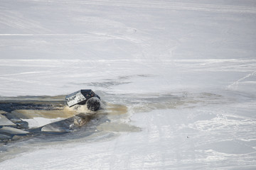 On snowy desert surface race on all-terrain suv top view copy space