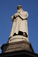 Monument to Leonardo Da Vinci with details around his statue on Piazza Della Scala in Milan, Italy.