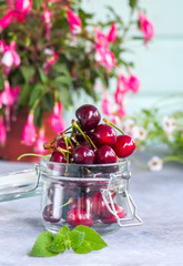 Group of Fresh Juicy Sweet Cherries in a Glass Jar. Natural Organic Food.
