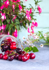 Group of Fresh Juicy Sweet Cherries in a Glass Jar. Natural Organic Food.