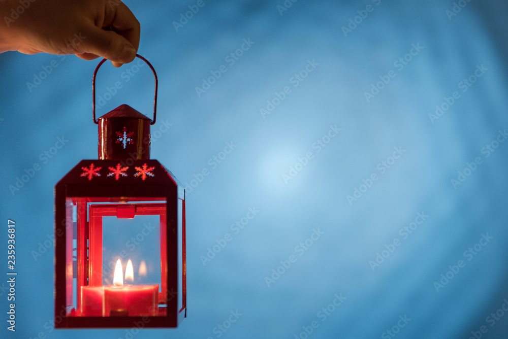 Wall mural Christmas burning candles on a blue background - Wall murals