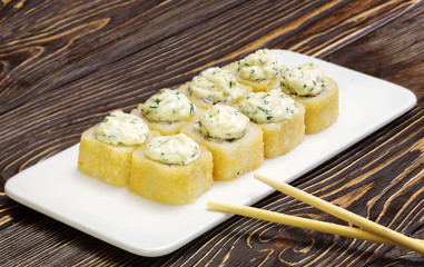 Japanese rolls, sushi on wooden background
