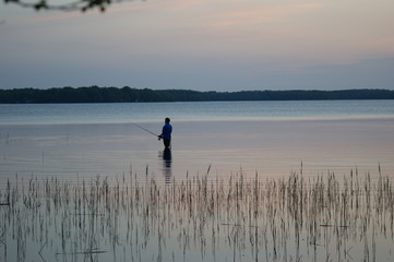 fisherman on the lake