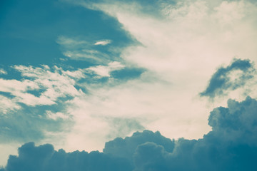 Obraz premium Turquoise blue and white cumulus clouds in sky. Vintage colors. For background and wallpaper