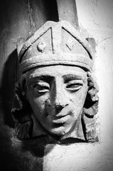 Fototapeta na wymiar stone carving of a man's face black and white