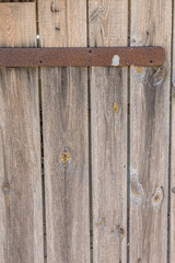 Door of the darkened boards of the old barn