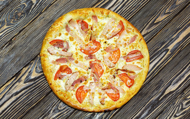 Italian pizza on wooden background, top view