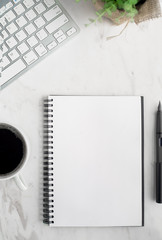 Home office workspace mockup with laptop, notebook and accessories on white background. Flat lay, top view