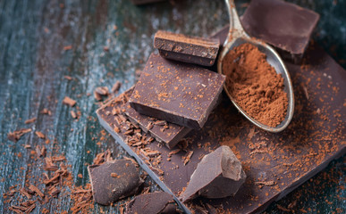 dark chocolate over wooden background