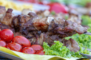 Street food, grilled meat on a spit. Homemade.