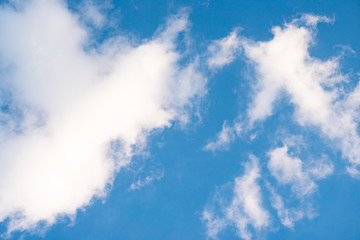 The sky is filled with beautiful clouds. The colors have a gradient and contrast.