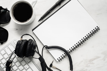 Home office workspace mockup with laptop, notebook and accessories on white background. Flat lay, top view