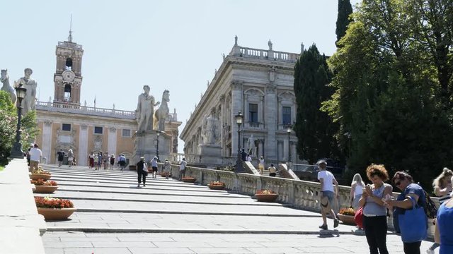 Time lapse. Zoom in. Tourists walking on Cordonata Stairs. Rome, Italy, 4K.