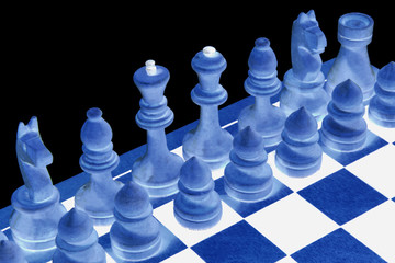 Abstraction. Chessboard with figures on a black background. Game for the mind and the development of thinking. Isolated.