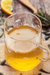 cup of green tea on rustic wooden table