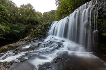 Fototapeta na wymiar Waterfalls along a walk in the Breacon Beacons, Wales