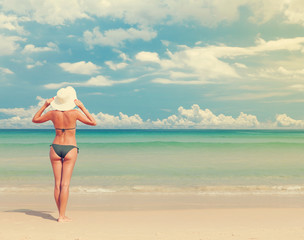 Fototapeta na wymiar Young attractive woman relax on the sea beach