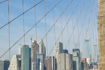 Fototapeta na wymiar Manhattan's skyscrapers behind the Brooklyn bridge