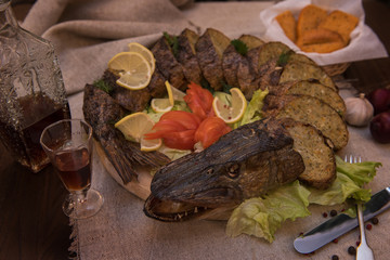 Stuffed pike with vegetables and greens. Russian food