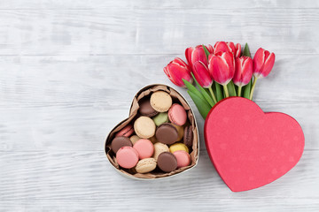 Red tulip flowers and macaroon cookies
