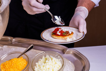 Decoration of pancakes boiled protein with red caviar